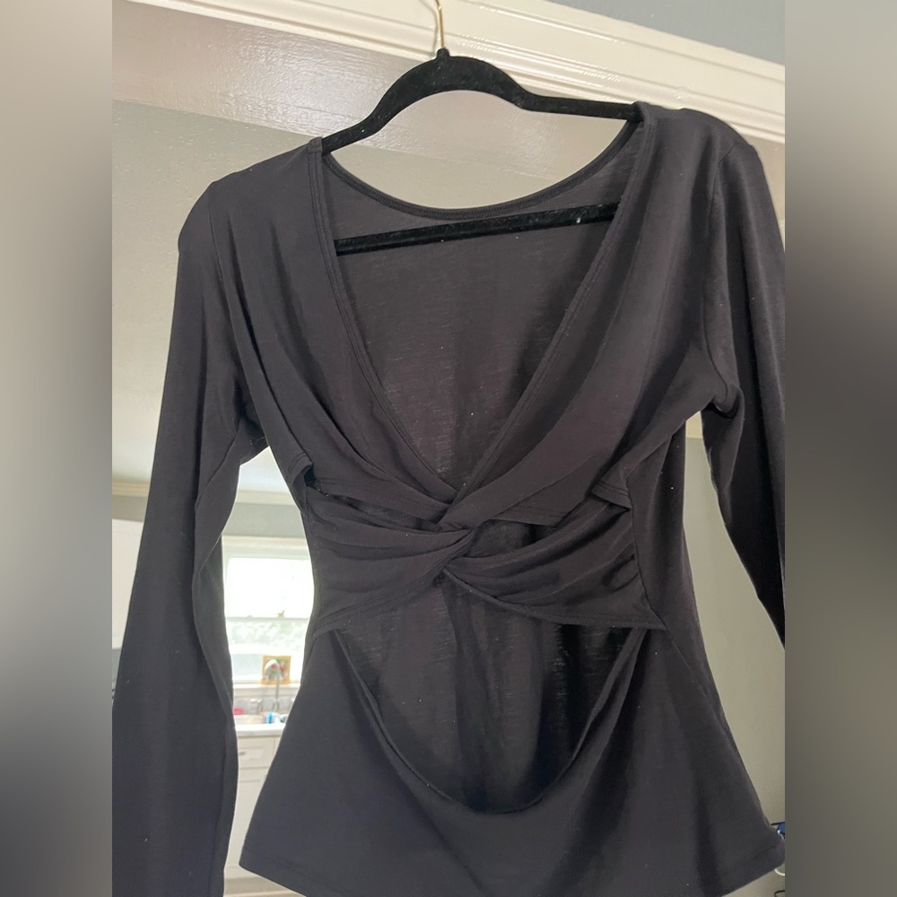 Black activewear top with partial open back